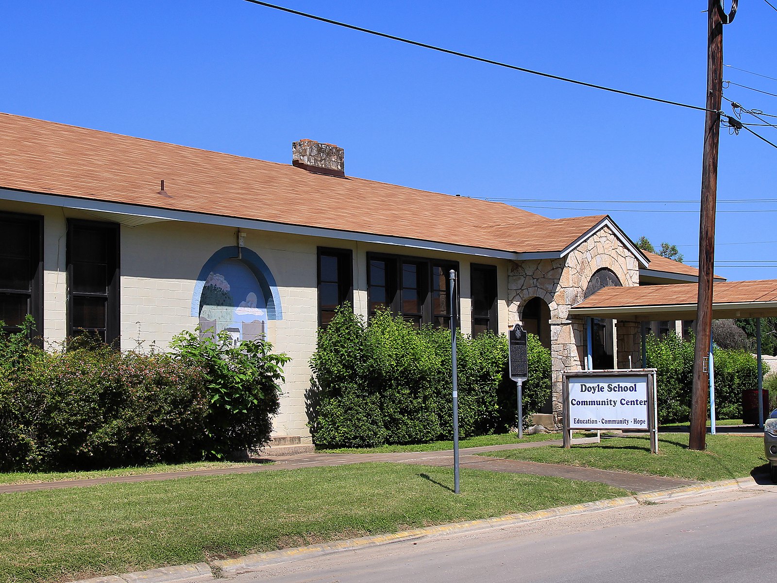 Families cheering at a Friday night football game